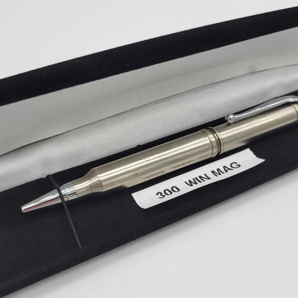 Close-up of 300 Win Mag bullet-style pen