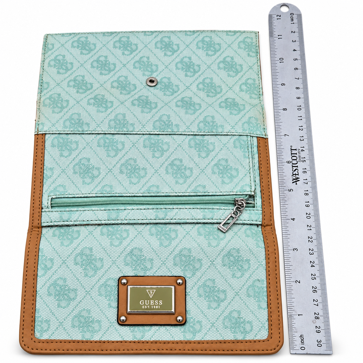 Guess wallet back with zip pocket and ruler for scale