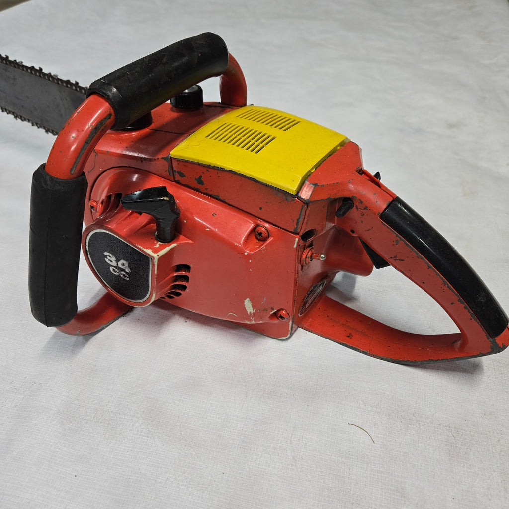 Vintage Mighty Mite Deluxe chainsaw rear side showing 34cc marking