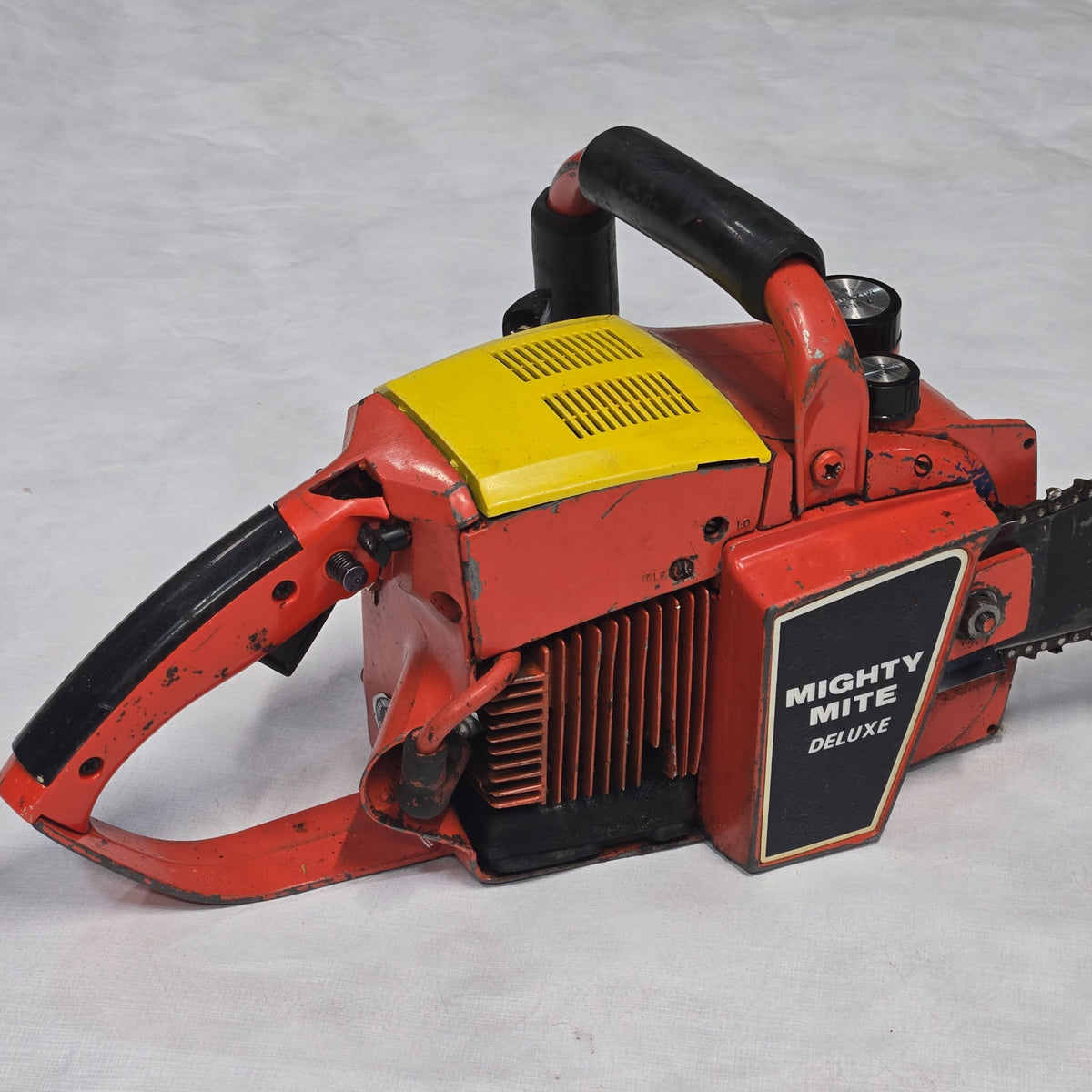 Vintage Mighty Mite Deluxe chainsaw side detail